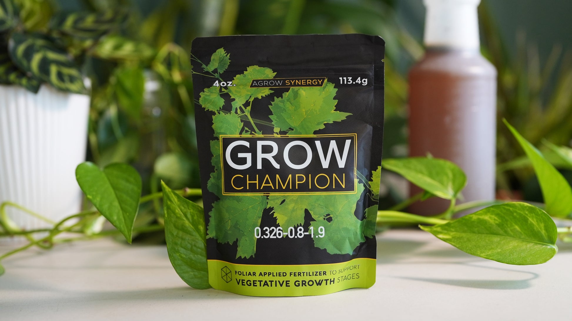 Grow Champion worm casting fertilizer packet with plants in the background